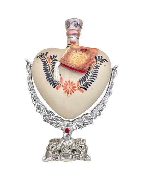 Buy Grand Love Tequila Reposado Ceramic Hand Painted Heart - Swing Metal Base online at whiskeyshipped.com and have it shipped to your door nationwide.